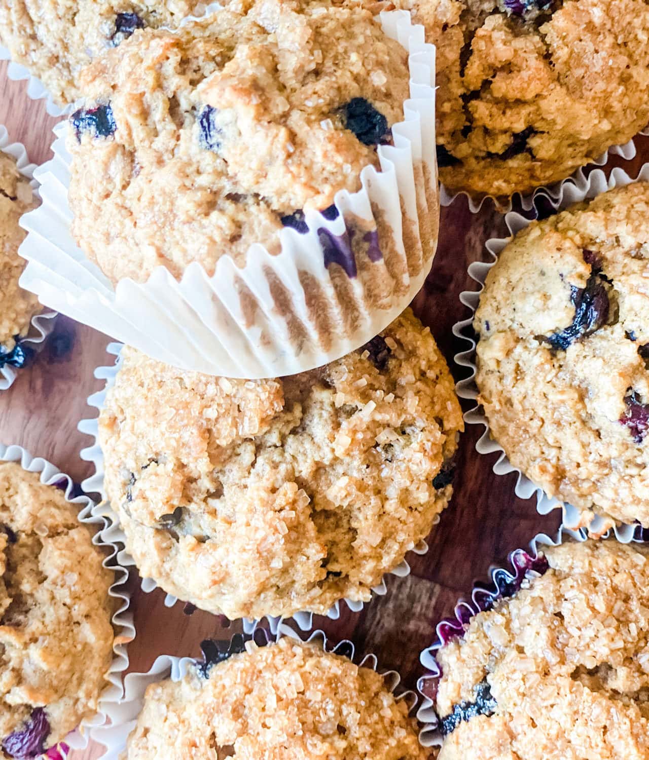 blueberry muffins in white paper muffin cups