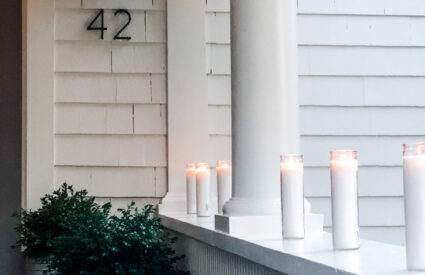 religious candles from Walmart to line the porch railings