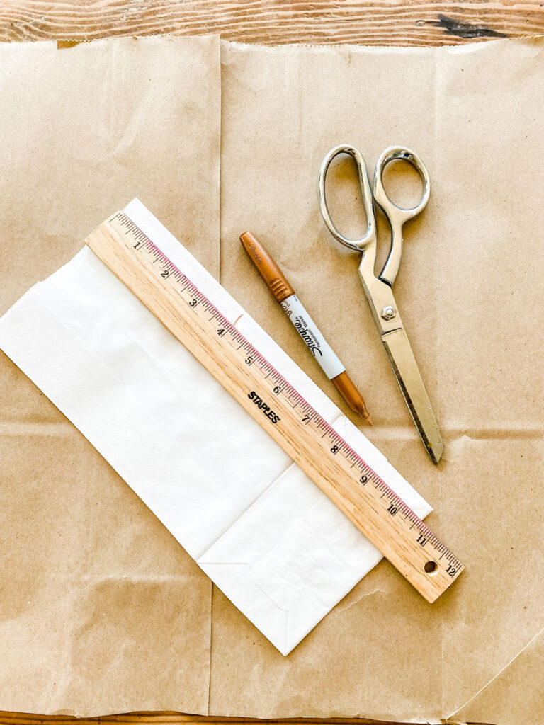 Ruler showing where to cut the bag for DIY Paper Bag Planters.