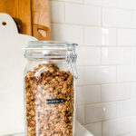 glass jar with granola and a DYMO label on the jar