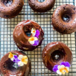 Chocolate Baked Donuts with Johnny Jump Up on the icing