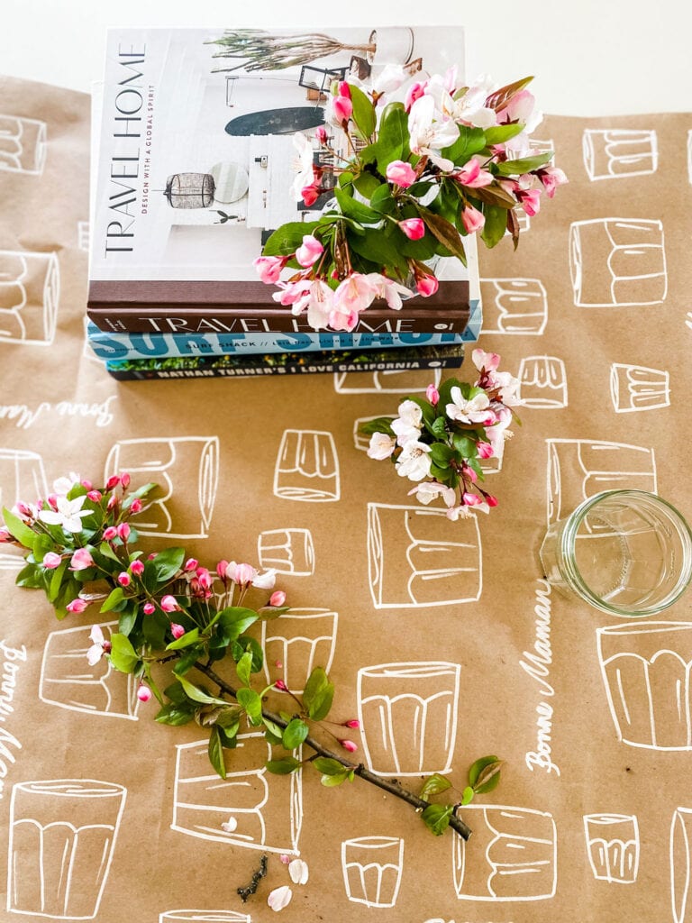 jars drawn in white marker on Kraft paper with flowers and books