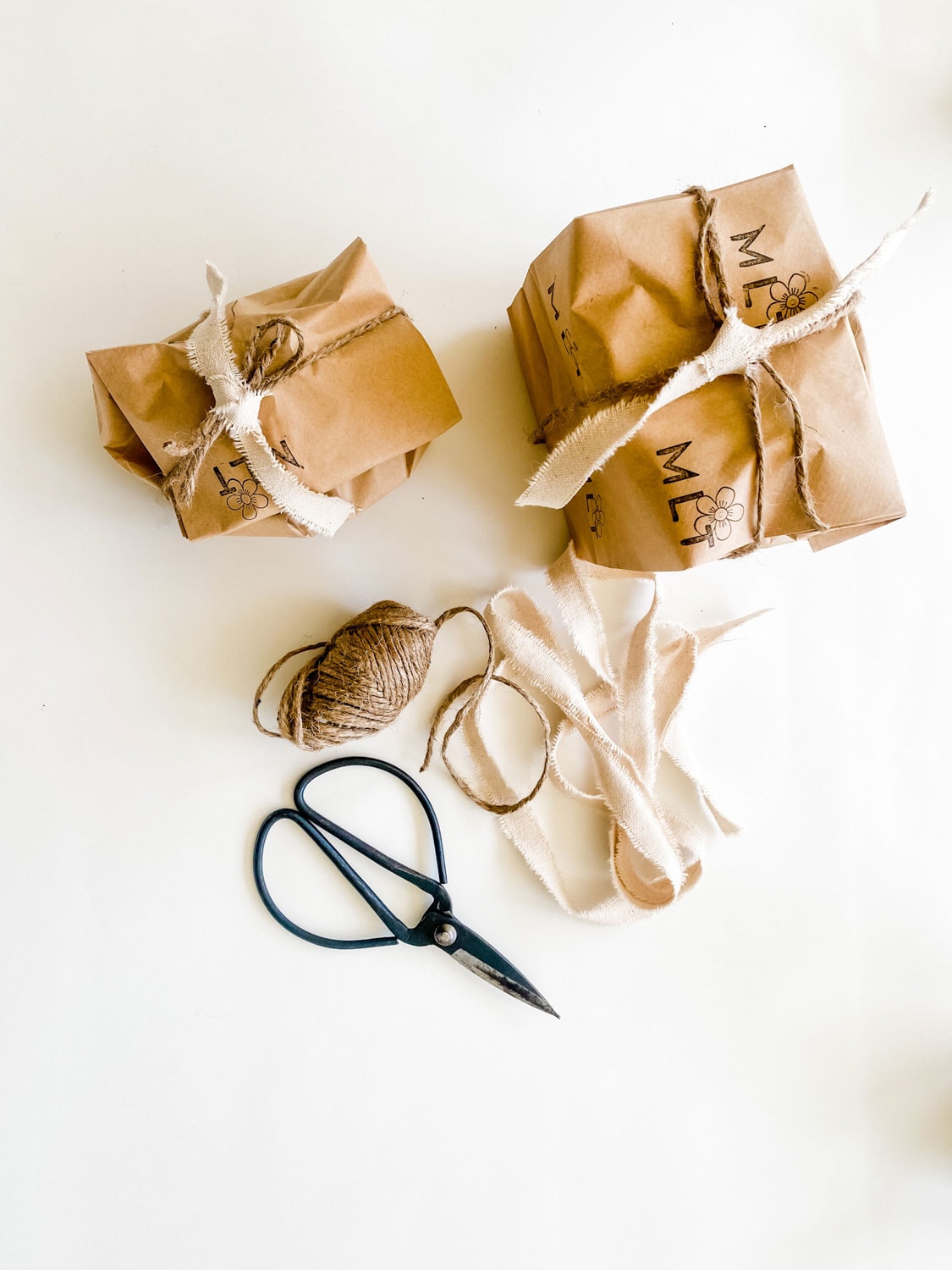 brown paper packages, twine, ribbon, scissors