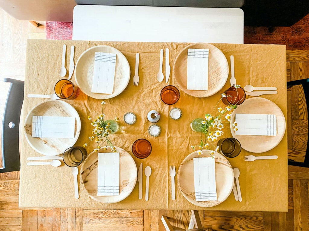 When hosting a dinner party in a small apartment with no dishwasher, use pretty paper products