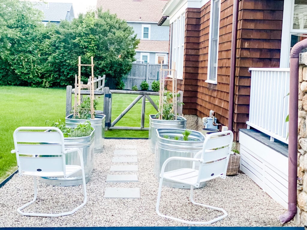 Stock Tank Garden with Pea Gravel and chairs