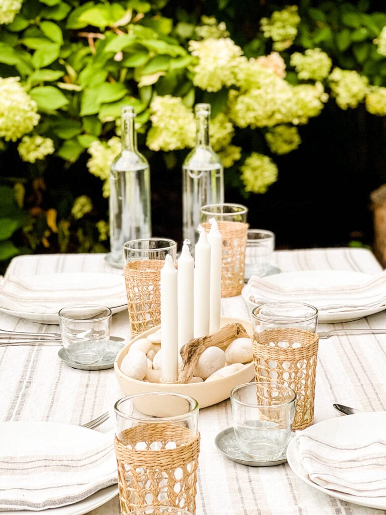  table with striped linens, raffia wrapped glassware