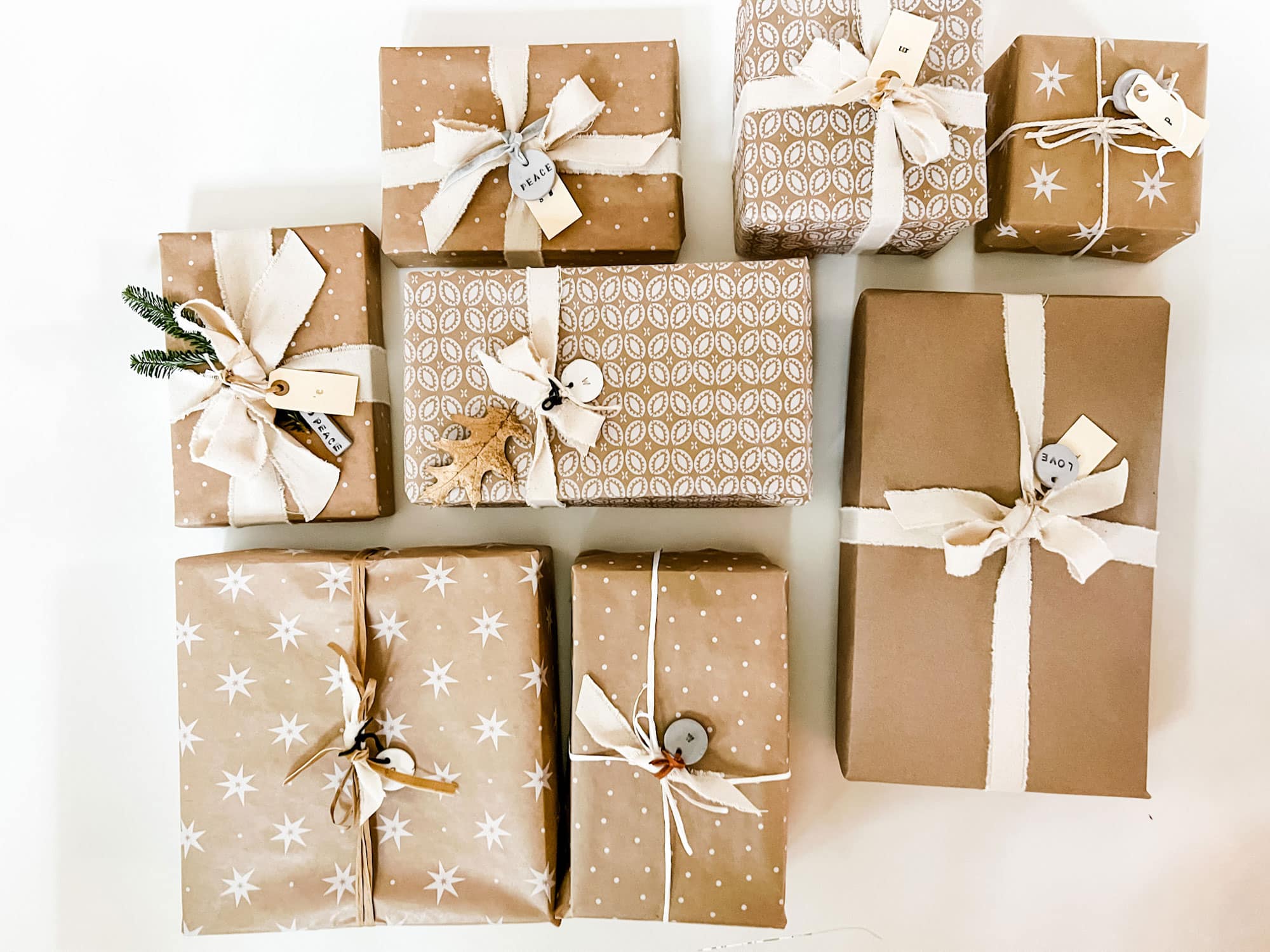 Simple gift wrap. Burlap, rustic linen, and classic brown wrapping paper  with some twine wrapped around…