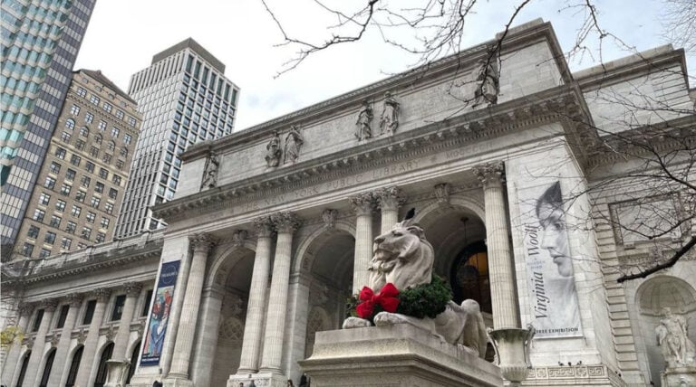 Patience and Fortitude, the marble statues at the NYPL wearing wreaths with big red bows