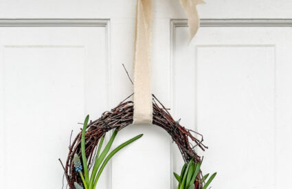 Easy Birch Twig Spring Wreath hung on door with frayed canvas