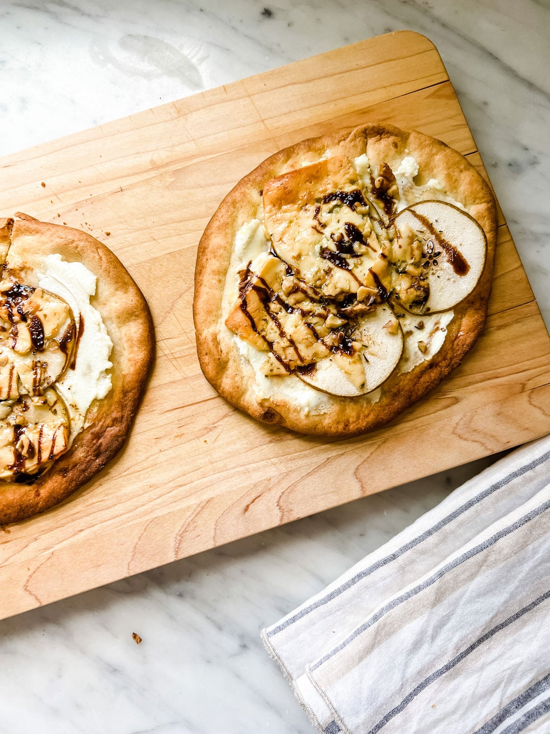 Quick & easy Pita Pizza - We used ricotta cheese, pears, gorgonzola, herbs de provence and walnuts with honey, olive oil, and balsamic