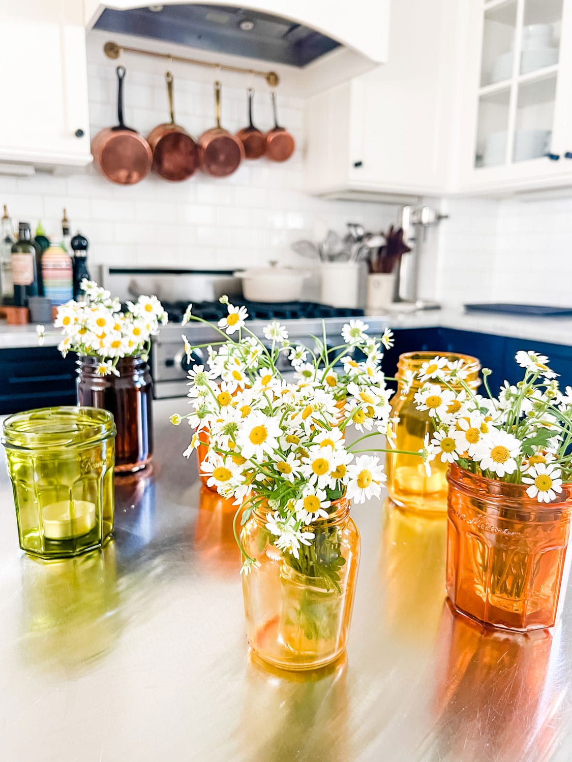 https://mostlovelythings.com/wp-content/uploads/2023/05/chamomile-in-tinted-glass-jars.jpg