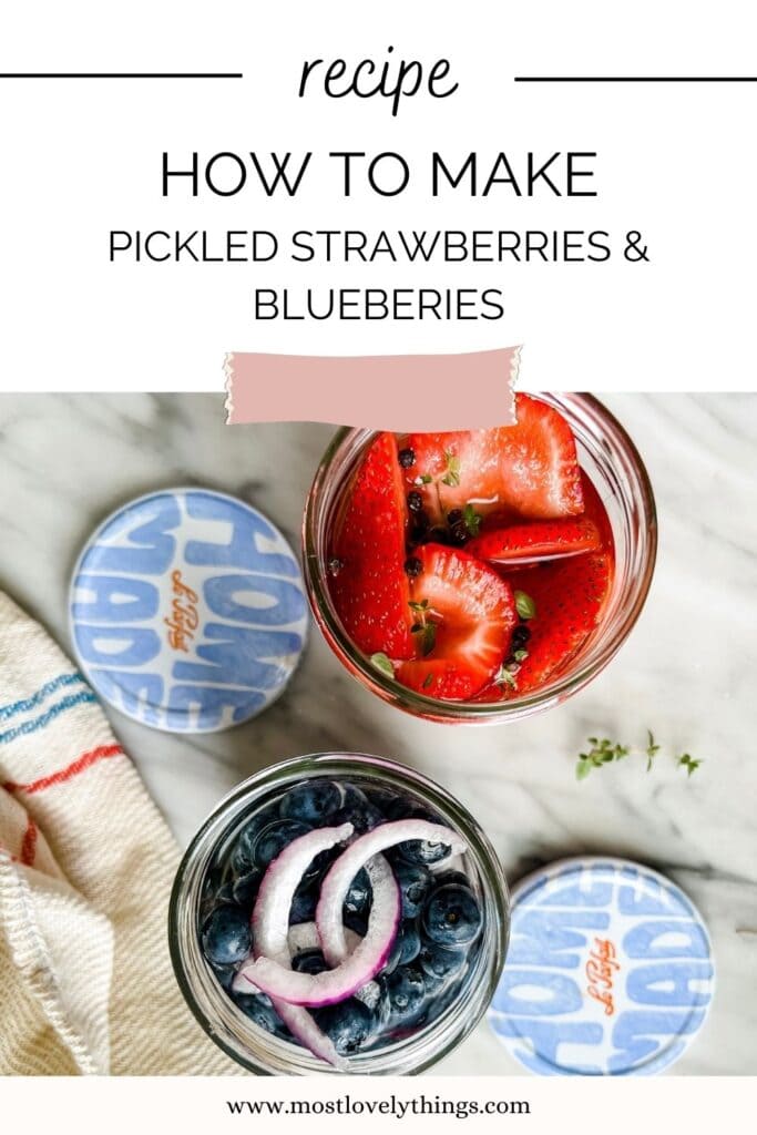 Jars with pickled strawberries and blueberries, lids, towel with red and blue stripe 