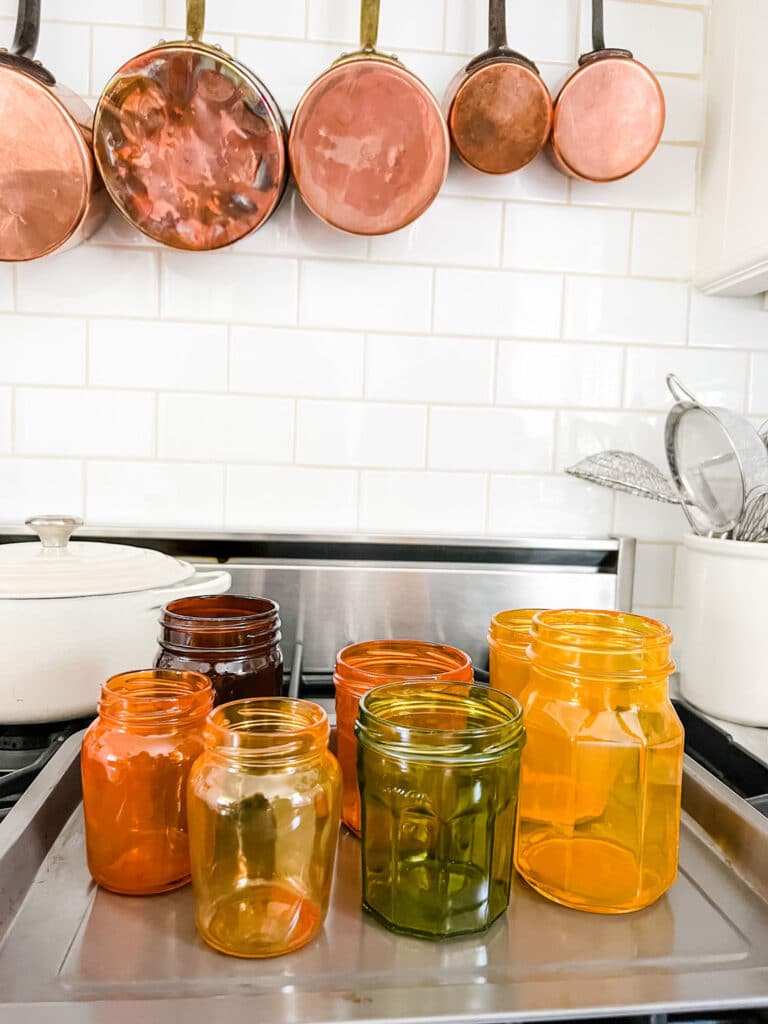 Tinted Glass Jars for a 1970s Look one baking sheet on top of oven