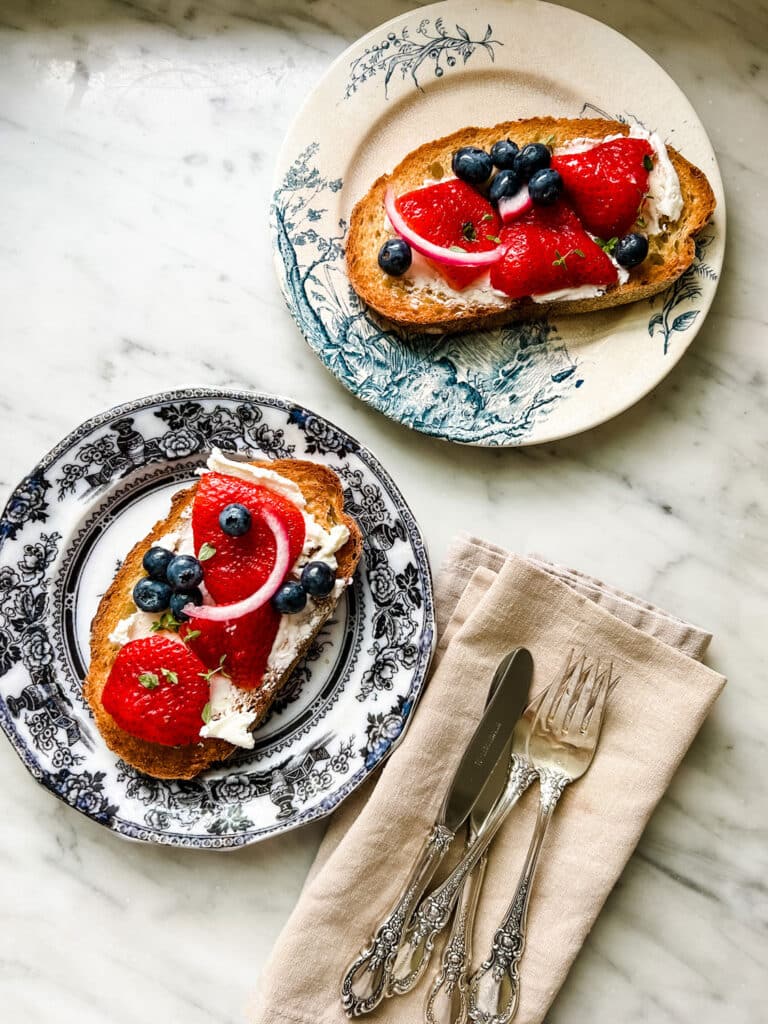 Tartine with Pickled Blueberries & Strawberries on vintage plates 