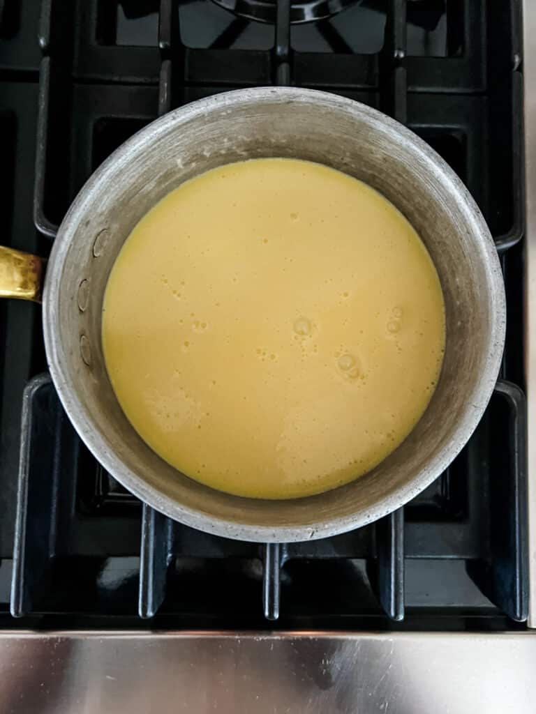 Vanilla cream in copper pot on the stove. 