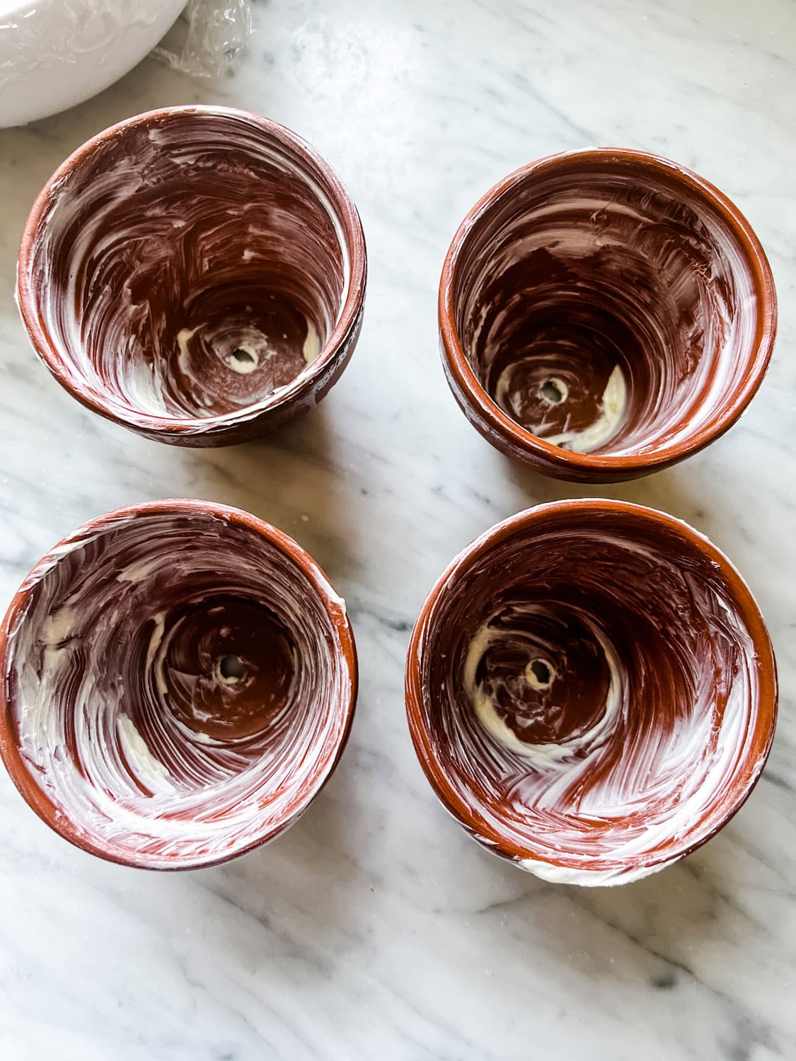 https://mostlovelythings.com/wp-content/uploads/2023/06/buttered-clay-pots.jpg