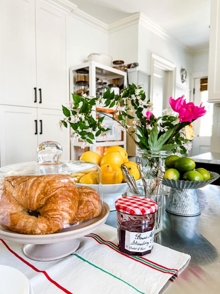 6 Simple Ways to Refresh Your Home For Summer - croissants, Bonne Maman jam, flowers, lemons, limes 