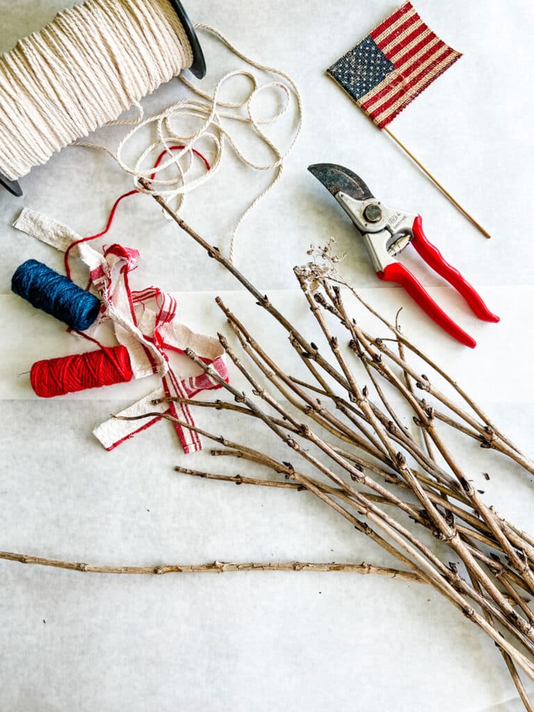  hydrangea twigs, small flag, jute twine in red and navy blue, clipper, macrame cord on spool 