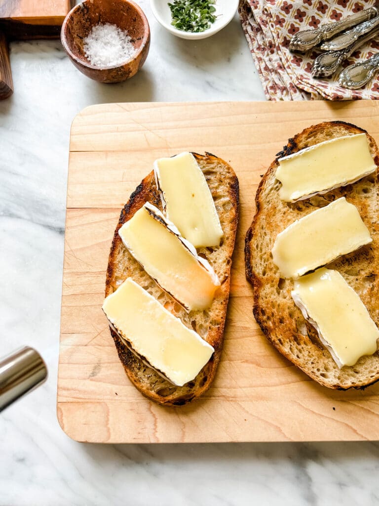 Make this Easy & Delicious Creme Brûlée Brie Tartine - kitchen torch with flame melting the cheese on toast 