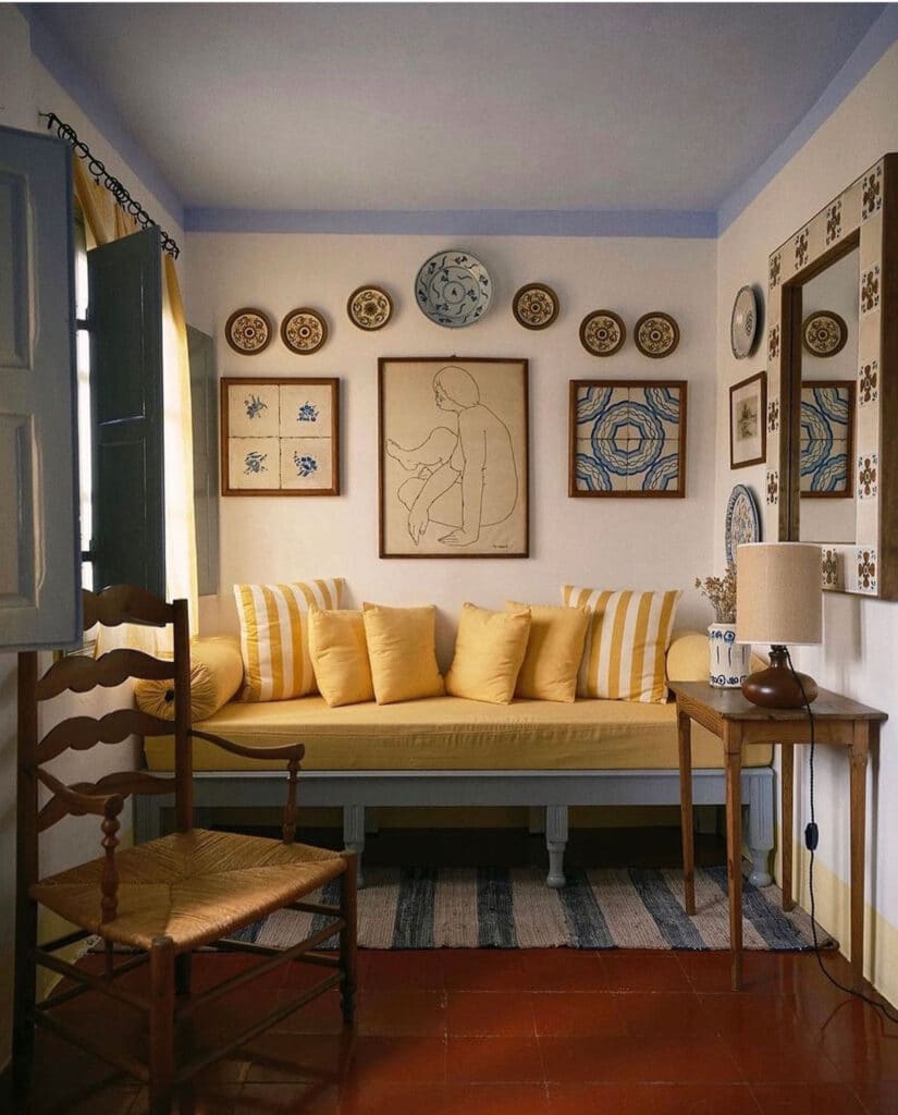 Displaying Plates on the Wall & Other Favorites - plates and art above daybed with pillows 
