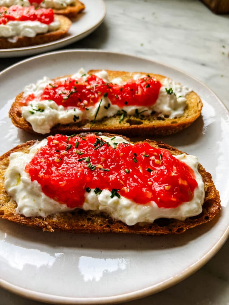 Burrata and fresh tomato sandwich with chives