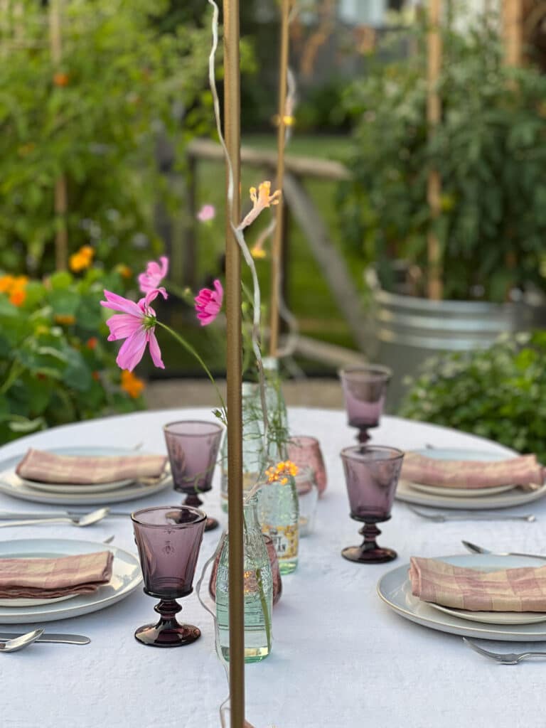 over-the-table rod from terrain. Use it with string lights, hang jars with votive tea lights or flowers.