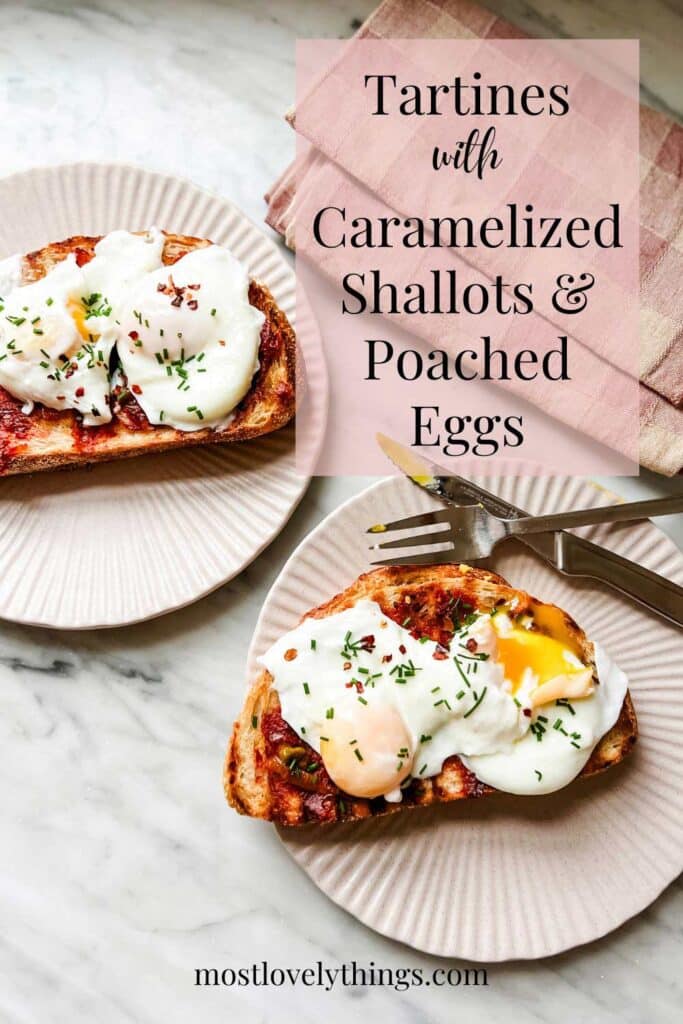 Poached eggs sit on top of toast and shallot mixture spread. They are topped with red pepper flakes and fresh chopped chives.