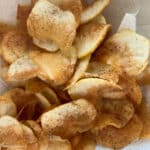 Homemade potato chips on paper towels