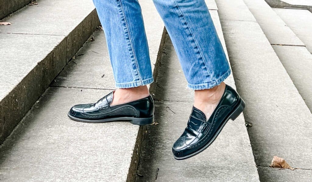 black loafers, jeans, walking up steps 