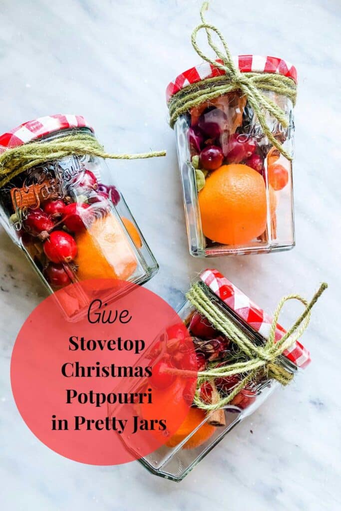 Three jars wrapped with twine around them including all the ingredients to make stove top Christmas potpourri.