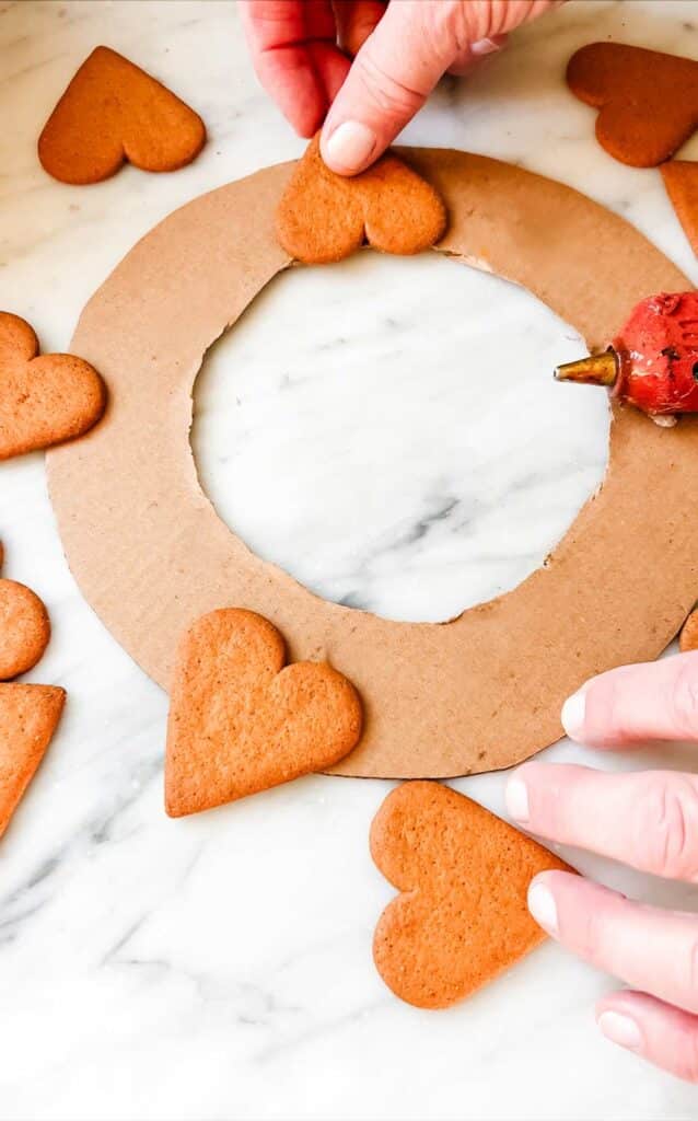 heart shaped gingerbread cookies on cardboard.