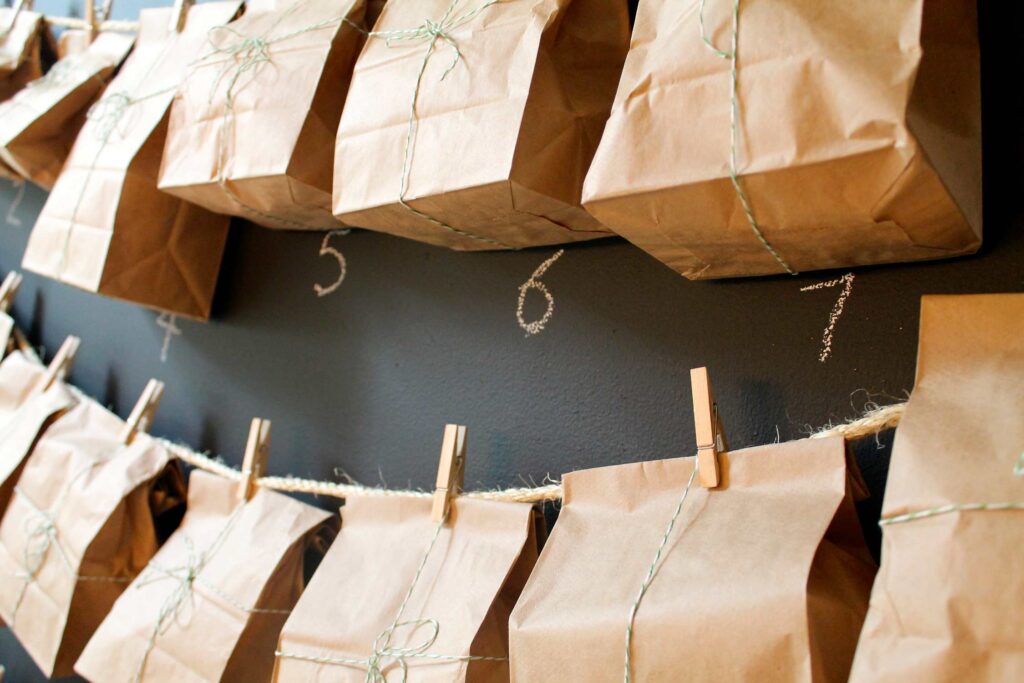Paper bag, chalkboard advent calendar with numbers in chalk