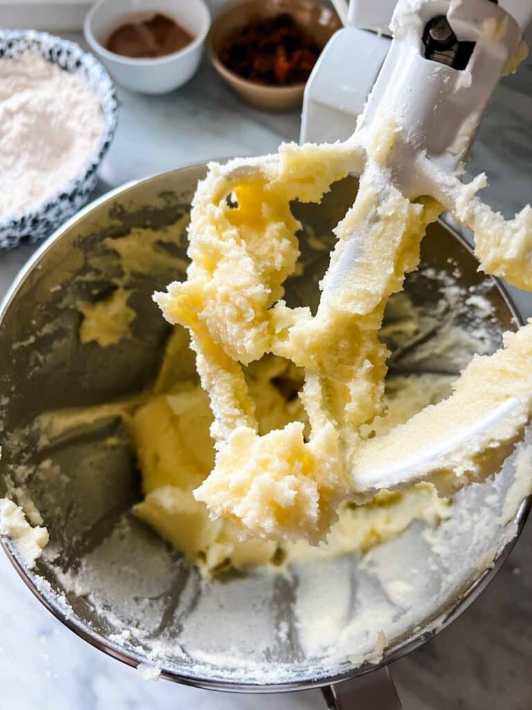 Butter and sugar have been mixed and creamed in a stand mixer.