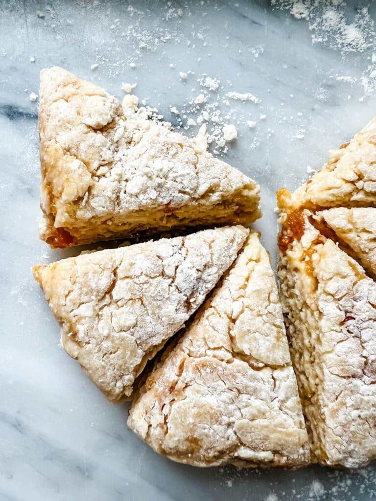 scones on marble with flour 