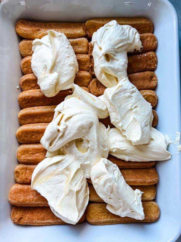 Ladyfinger cookies are layered with tiramisu cream.