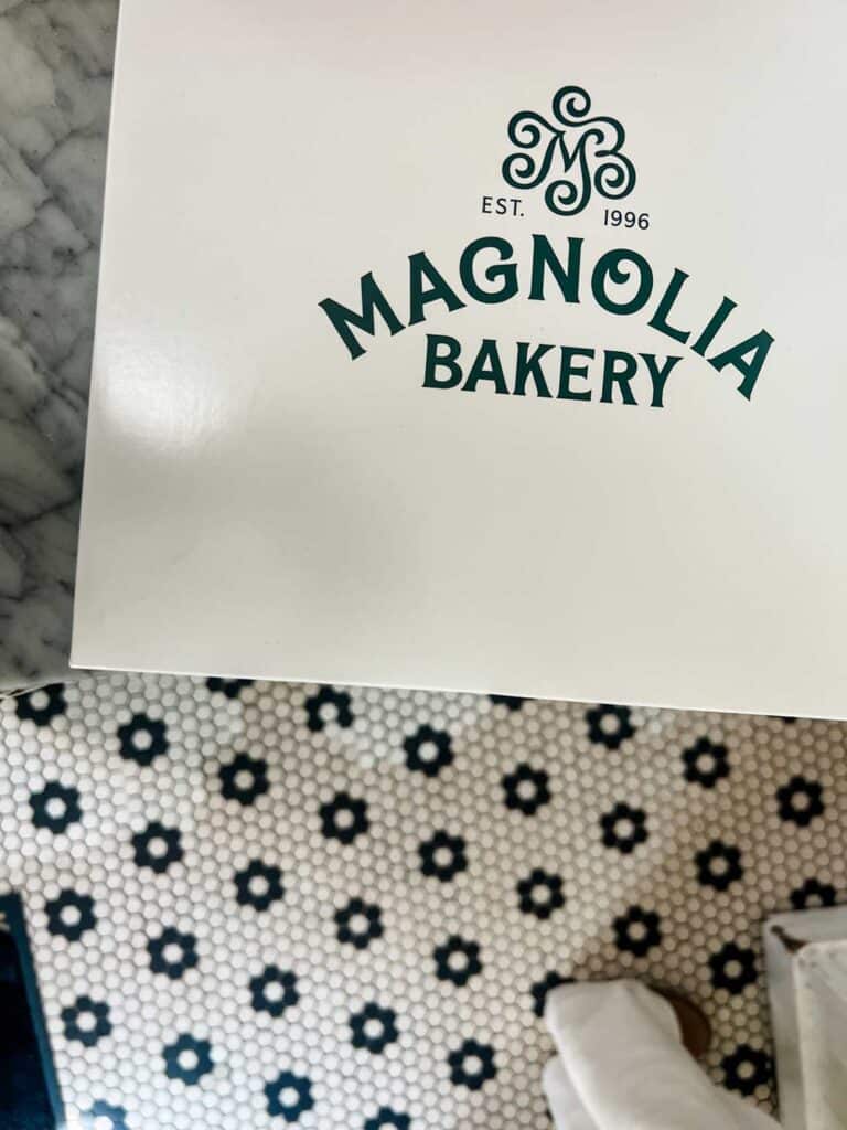 A cake box and napkin at Magnolia Bakery.