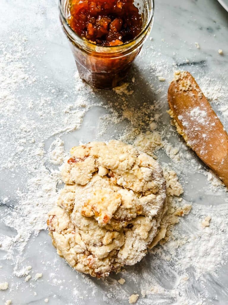 scone dough with jar of marmala