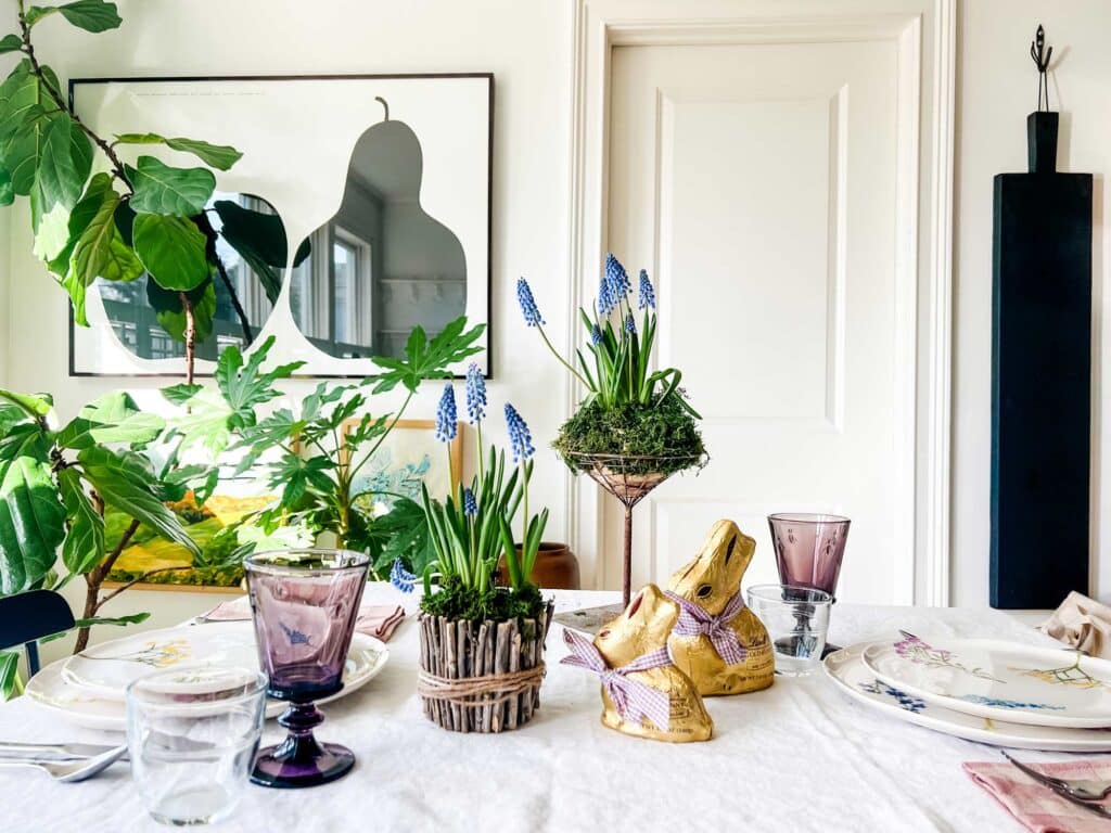 Make a simple spring centerpiece for the table DIY that you can use for Easter. Add in some chocolate bunnies for fun.