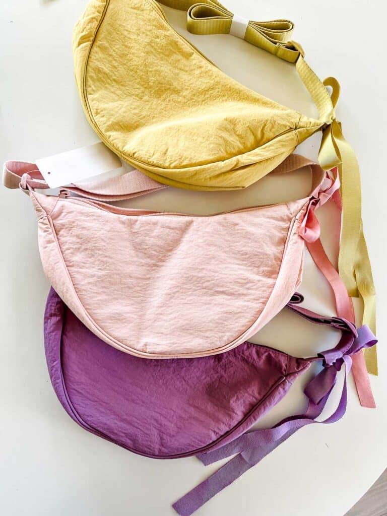 The round mini shoulder cross body bags from Uniqlo with matching ribbons in Easter egg colors