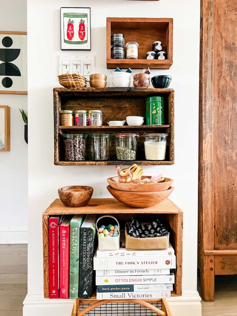 Vintage crates filled with kitchen staples, cookbooks, and some fresh flowers add a simple sprint touch to any home.