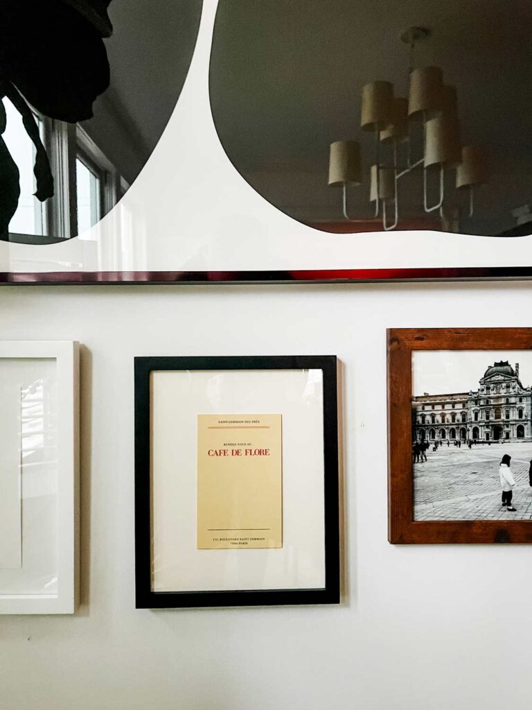 A pocket card for the check at Cafe De Flore was mounted and framed.