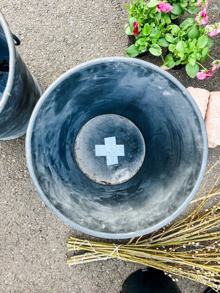 Duct tape and plastic liners will keep your porch planters from leaking water.