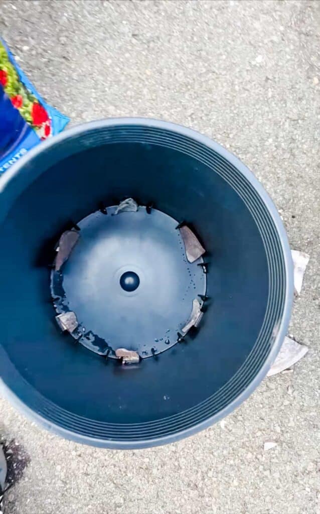 The drainage holes of a plastic liner for pots are used to cover the holes and keep the potting mix from slipping through.