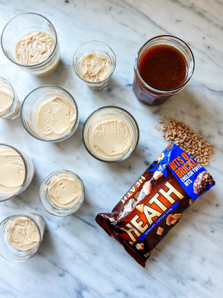 Butterscotch pudding has been chilled and is ready to be topped with salted caramel sauce, and heath bar crunch.