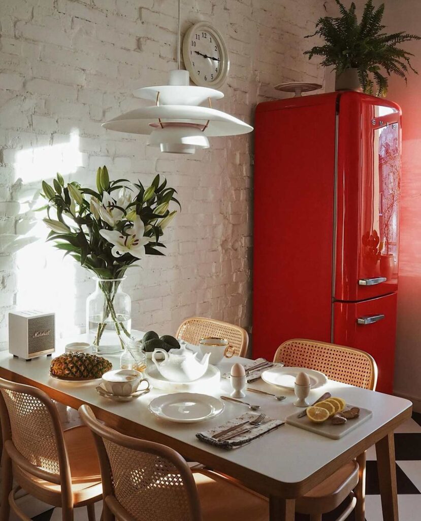The unexpected red theory in home design pops up in the kitchen.