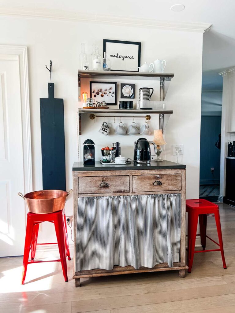 The unexpected red theory in home design is on display here as red bar stools provide a. great accent color.