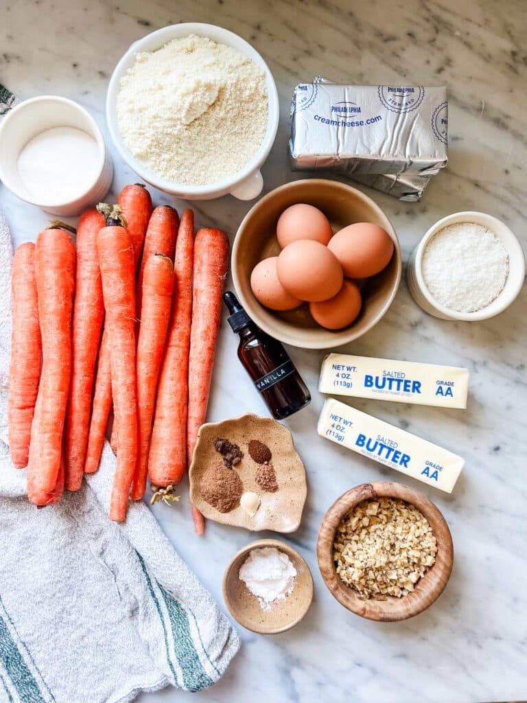 All the ingredients for the best low carb carrot cake are measured and sitting on the kitchen counter.