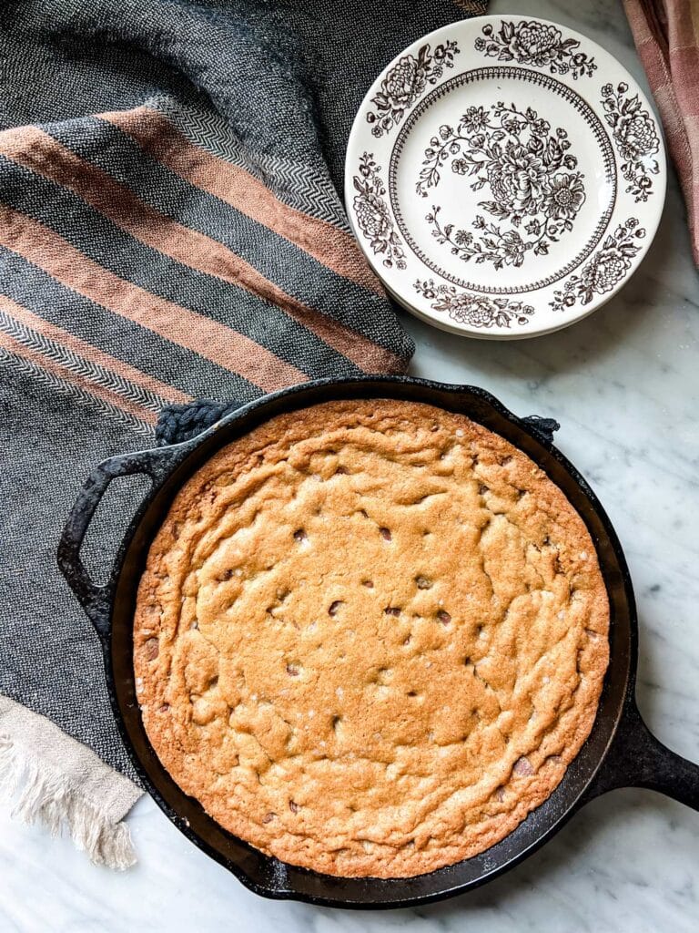 A giant skillet chocolate chip cookie straight from the oven.