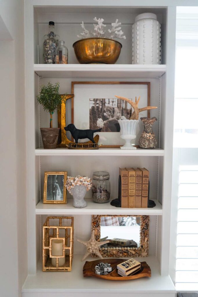 A built-in wall shelf is a great way to showcase many different finds for thrifting your way to a cozy house.