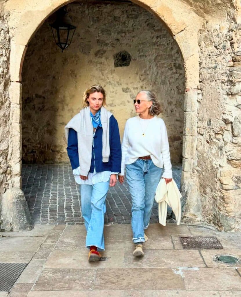 Two models strolling in France both wearing looser fit jeans.